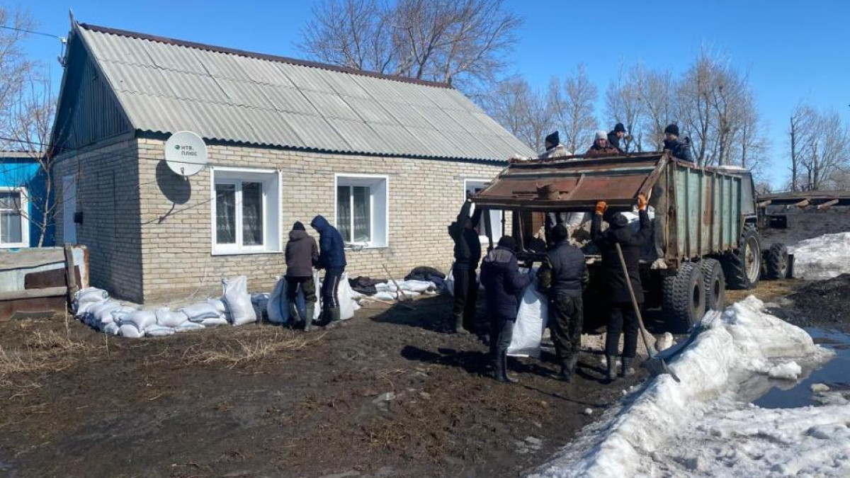 Melt water pumped out of flooded houses in Kostanay region